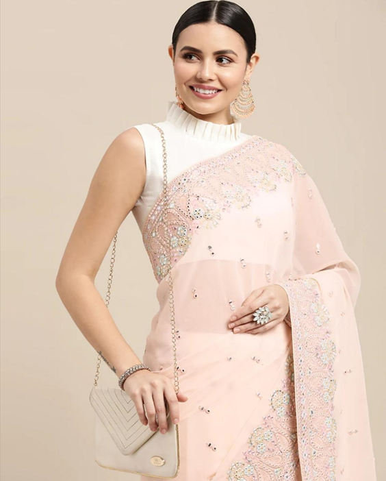 chikankari saree blouse designa
Sleeveless Blouse With Ruffled Neckline  